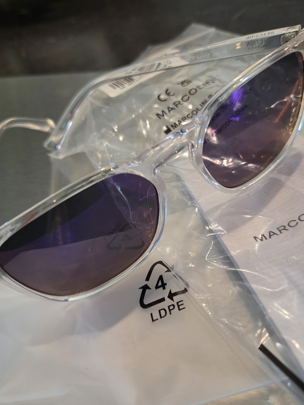 Women’s Clear Frame Sunglasses with Purple Lenses